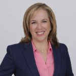 Nancy Headshot in Blue Jacket